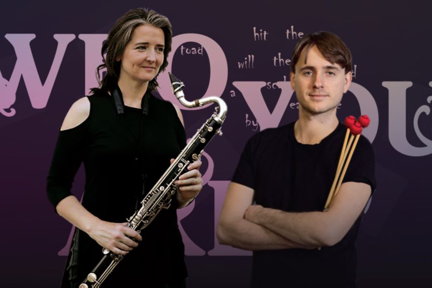 Deirdre O'Leary holding a bass clarinet and Alex Petcu holding mallets, in front of a purple wall with lettering